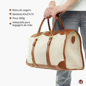 Bolsa de lona feminina Le Classique com alças de ombro e detalhes em couro sintético, com design elegante e versátil para o dia a dia e viagens curtas.