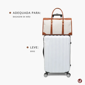 Bolsa de lona feminina Le Classique com alças de ombro e detalhes em couro sintético, com design elegante e versátil para o dia a dia e viagens curtas.