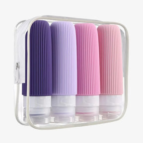 Kit Silicase com 4 frascos de silicone coloridos para viagem de 90ml e nécessaire transparente, ideal para levar produtos de higiene na bagagem de mão.