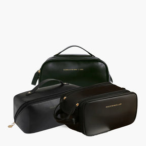 Kit Luxbag com três nécessaires femininas premium em couro ecológico, organizadas juntas para demonstrar os diferentes tamanhos ideais para viagens e rotina diária.