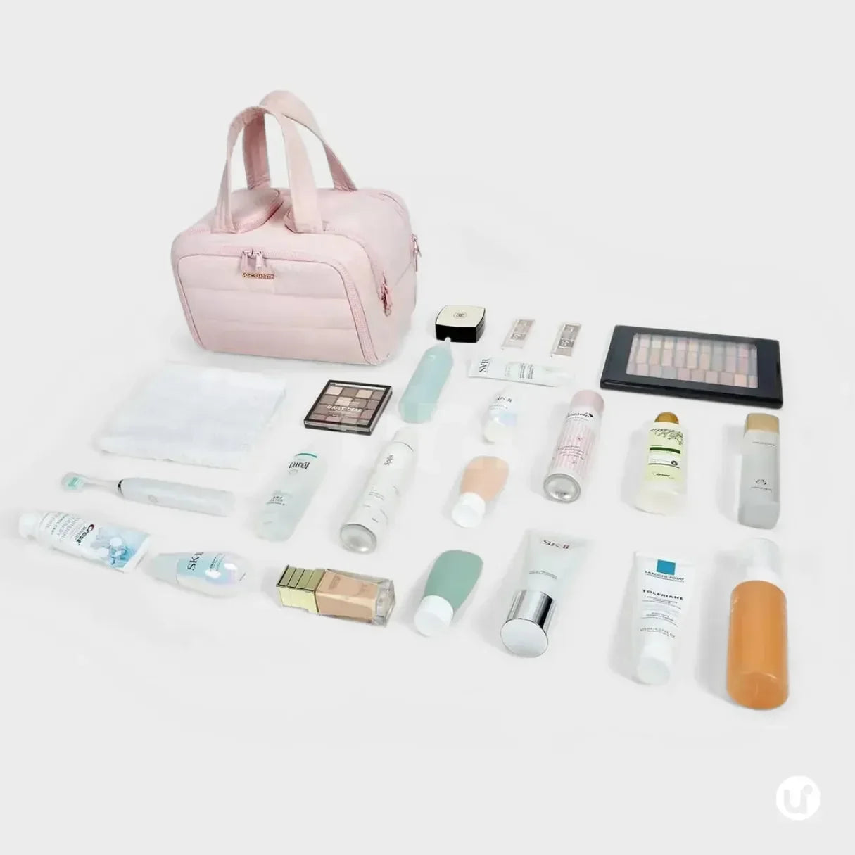 Nécessaire feminina grande CrushBag em tecido impermeável semibrilhante, com design elegante inspirado em nuvens, ideal para organizar itens de viagem com sofisticação.